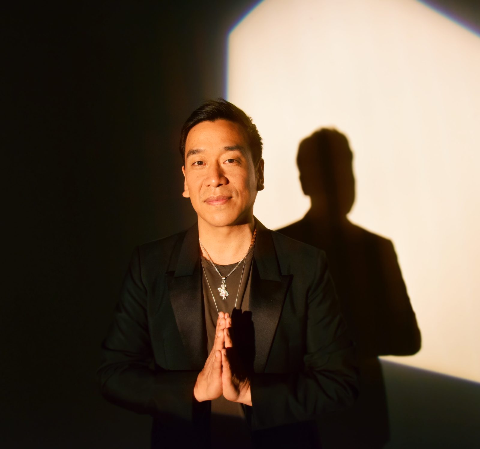Ian Pai with his hands in prayer position